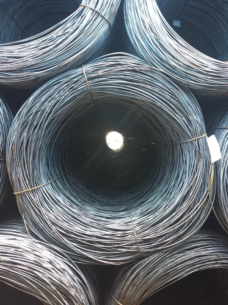 Steel wire rod coils bundled and stored for industrial manufacturing and construction applications